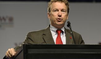 ** FILE ** Sen. Rand Paul, Kentucky Republican, addresses the 114th annual national convention of the Veterans of Foreign Wars on Monday, July 22, 2013, at the Kentucky International Convention Center in Louisville, Ky. (AP Photo/Timothy D. Easley)