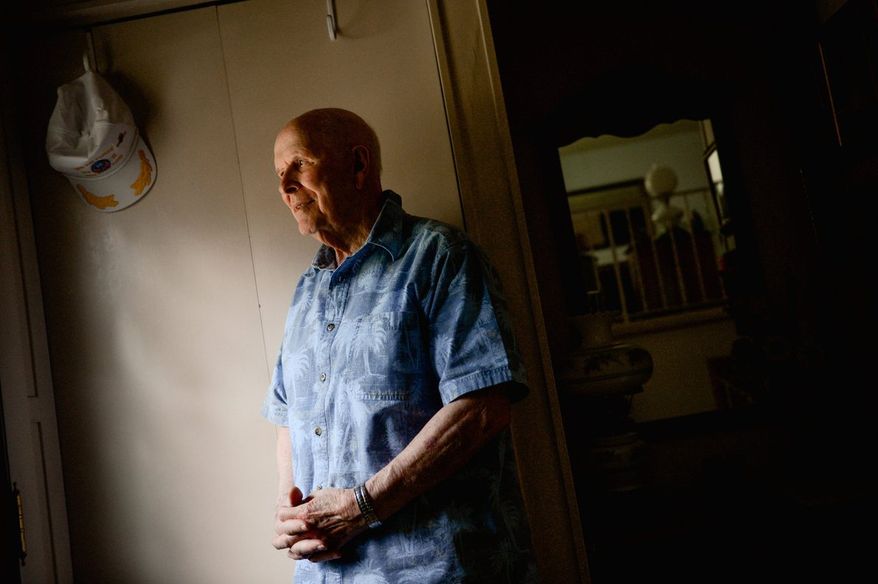 "If you've got a job to do, you've got a job to do," says Millard "Lefty" Palmer of the daring maneuver with unexploded bombs stuck in his plane near the end of World War II. "Just do it, get it done, and then worry about other things." Sixty-seven years later, he received a Distinguished Flying Cross (with valor) from Rep. Gerald E. Connolly.
(Andrew Harnik/The Washington Times)