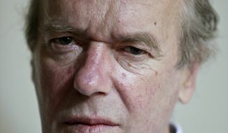 British novelist Martin Amis (shown here in 2012) appeared with fellow novelists and old friends Ian McEwan and Salman Rushdie in New York on Monday. (AP Photo/Bebeto Matthews,File)
