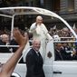 Pope Francis waves from his popemobile as he makes his way into central Rio de Janeiro, Brazil, Monday, July 22, 2013. The pontiff arrived for a seven-day visit in Brazil, the world&#39;s most populous Roman Catholic nation. (AP Photo/Victor R. Caivano) **FILE**