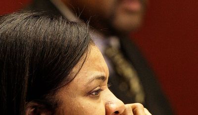 Detroit City Council President Pro Tem Monica Conyers, foreground is shown  in a council meetin with Council President Ken Cockrel Jr., background, in Detroit, Tuesday, Sept. 9, 2008. Conyers, the wife of a one of the nation&#39;s most powerful congressmen, John Conyers, and one of the most volatile and unpredictable elected leaders in Detroit. She has been accused of threatening to shoot a mayoral staffer and publicly called the city council president, and now incoming mayor, &quot;Shrek.&quot; In less than two weeks, she takes over as Detroit City Council president when Ken Cockrel Jr. moves up to the mayor&#39;s office, replacing the disgraced Kwame Kilpatrick.  (AP Photo/Paul Sancya)