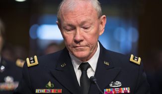 ** FILE ** Gen. Martin Dempsey, chairman of the Joint Chiefs of Staff, appears before the Senate Armed Services Committee for a hearing to consider his reappointment to the military&#39;s highest post, on Capitol Hill in Washington, Thursday, July 18, 2013. (AP Photo/J. Scott Applewhite)