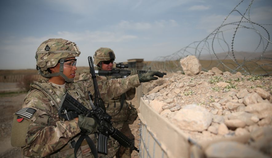 U.S. Army 1st Lt. Audrey Griffith, left, and Spc. Heidi Gerke, both with the 92nd Engineer Battalion, stand guard during a force protection exercise at Forward Operating Base Hadrian in Uruzgan province, Afghanistan, March 18, 2013. (DoD courtesy photo by U.S. Army/Released)