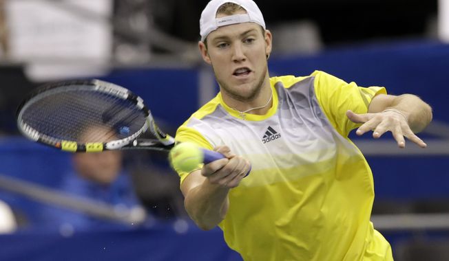 **FILE** Jack Sock returns a shot to Feliciano Lopez, of Spain, in a quarterfinal round tennis match at the U.S. National Indoor Championships on Friday, Feb. 22, 2013, in Memphis, Tenn. (AP Photo/Mark Humphrey)