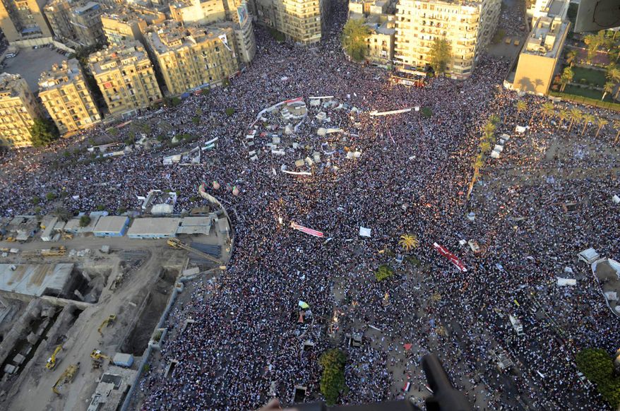 Opponents of ousted Egyptian President Mohammed Morsi protest at Tahrir Square in Cairo on Friday, July 26, 2013. Security forces clashed with Mr. Morsi's supporters early Saturday in the country's bloodiest incidence of violence since the military deposed him. (AP Photo/Hossam Diab, Egyptian army)