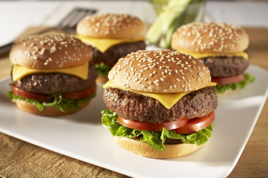 **FILE** Americans celebrate National Cheeseburger Day on Sept. 18, 2010. (PRNewsFoto)