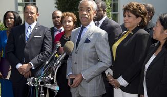 Rev. Al Sharpton (center), accompanied by La Raza President Janet Murguia (right), National Urban League President and CEO Marc Morial (left) and others, speaks during a news conference outside the West Wing of the White House on July 29, 2013, about the Voting Rights Act, after a meeting with President Obama and Attorney General Eric Holder. (Associated Press)