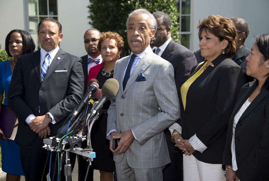 Rev. Al Sharpton (center), accompanied by La Raza President Janet Murguia (right), National Urban League President and CEO Marc Morial (left) and others, speaks during a news conference outside the West Wing of the White House on July 29, 2013, about the Voting Rights Act, after a meeting with President Obama and Attorney General Eric Holder. (Associated Press)