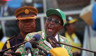 Zimbabwean President Robert Mugabe addresses supporters at his last campaign rally in Harare, Zimbabwe, on Sunday, July 28, 2013. Mr. Mugabe, who has been in power for 33 years, is seeking another term in elections Wednesday. (AP Photo/Str)