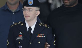 Army Pfc. Bradley Manning is escorted out of a courthouse at Fort Meade, Md., on Tuesday, July 30, 2013, after receiving a verdict in his court-martial. Manning was acquitted of aiding the enemy — the most serious charge he faced — but was convicted of espionage, theft and other charges, more than three years after he spilled secrets to WikiLeaks. (Associated Press)