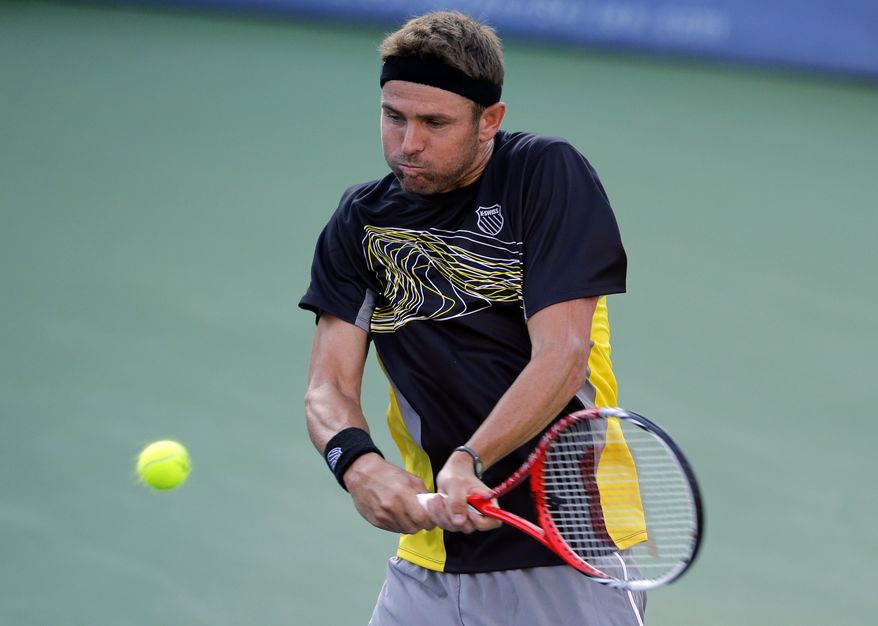 Mardy Fish hits the ball during his match against Matthew Ebden, from Australia, at the Citi Open tennis tournament, Monday, July 29, 2013 in Washington. Fish won 2-6, 6-1, 6-3. (AP Photo/Alex Brandon)