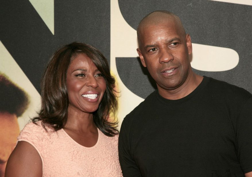 Actor Denzel Washington, right, attends the premiere of "Two Guns" with his wife actress Pauletta Washington, left, on Monday, July 29, 2013, in New York. (Photo by Andy Kropa/Invision/AP)
