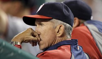 Washington Nationals manager Davey Johnson watches from the dugout during the eighth inning of a baseball game against the Detroit Tigers in Detroit, Tuesday, July 30, 2013. (AP Photo/Carlos Osorio)
