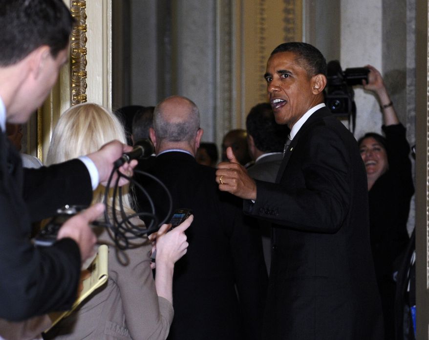 President Obama responds to a reporter's question as he leaves a meeting with Senate Democrats on Capitol Hill in Washington on July 31, 2013. (Associated Press)