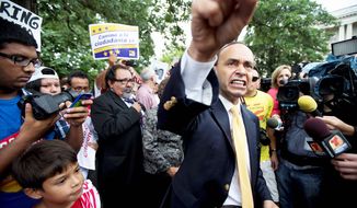 Democratic Reps. Luis V. Gutierrez (foreground) of Illinois and Raul M. Grijalva of Arizona join immigration reform supporters Thursday at a protest on Capitol Hill, marking an escalation in efforts to push for a bill this year that contains a pathway to citizenship. (Associated Press)