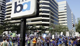 ** FILE ** In this file photo from Monday, July 1, 2013, striking Bay Area Rapid Transit workers picket as they close the intersection of 14th &amp; Broadway in downtown Oakland, Calif. The two sides were set to resume negotiations at noon on Thursday, Aug. 1, but did not appear close to an agreement. (AP Photo/Ben Margot)

