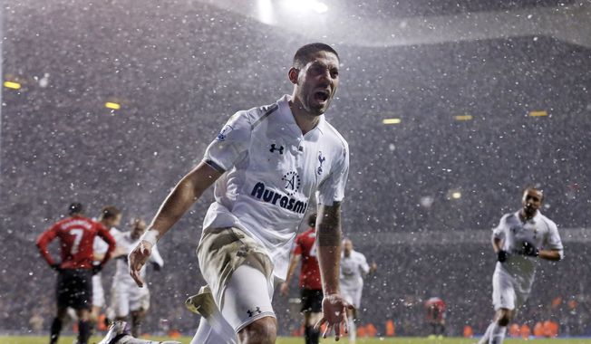 FILE - In this Jan 20, 2013, file photo, Tottenham Hotspur's Clint Dempsey celebrates after scoring a goal against Manchester United during an English Premier League soccer match at White Hart Lane stadium in London. Dempsey is returning to Major League Soccer, ending his six-year spell in English soccer.The 30-year-old Dempsey played for the New England Revolution from 2004-06 before joining Fulham in 2007. He moved to Tottenham last summer and scored 12 goals in 43 games, but wasn't a regular. (AP Photo/Matt Dunham, File)