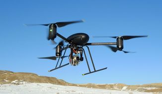 ** FILE ** A small Draganflyer X6 drone is photographed during a test flight in Mesa County, Colo., on Jan. 8, 2009. (Associated Press/Mesa County Sheriff&#39;s Department)