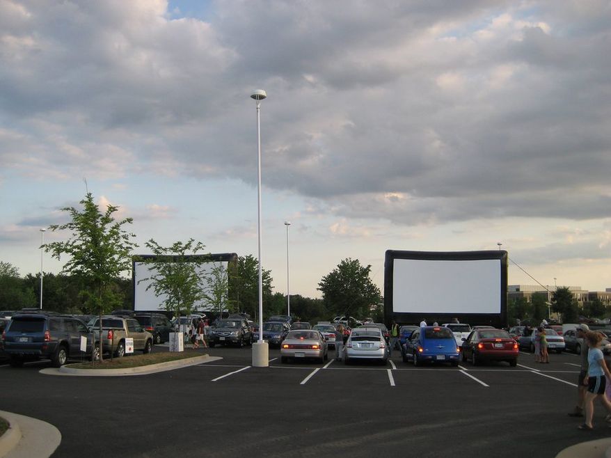 Comcast Outdoor Film Festival moviegoers watch films on a 3-story high screen. Movie fans attending this year's festival can see three films over three nights Aug. 16-18. Proceeds support the National Institutes of Health charities that aid children with serious illnesses.