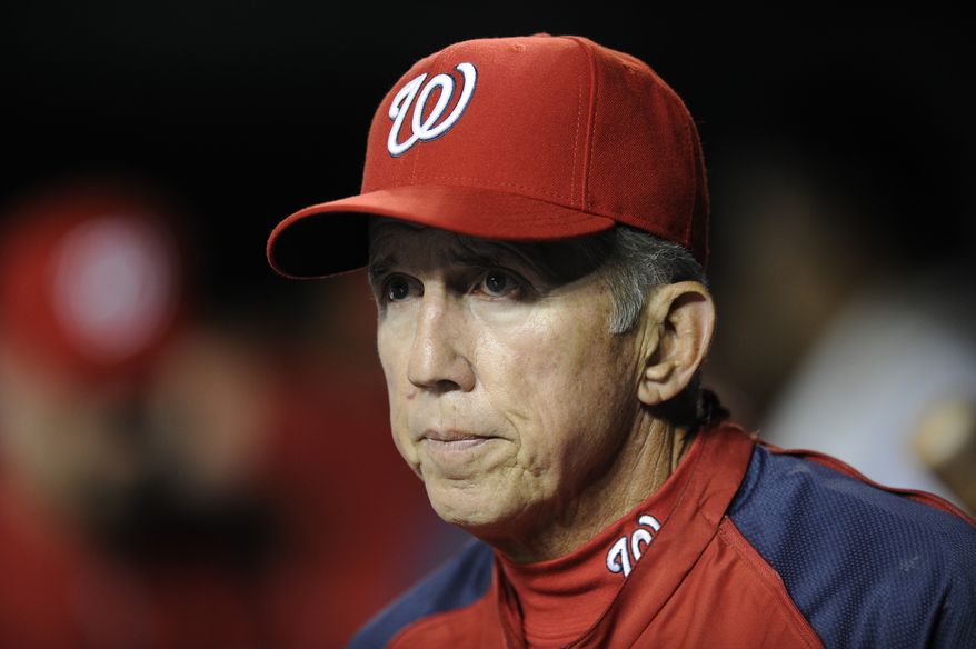 Washington Nationals manager Davey Johnson looks on from the dugout during the sixth inning of a baseball game against the Atlanta Braves, Wednesday, Aug. 7, 2013, in Washington. (AP Photo/Nick Wass)