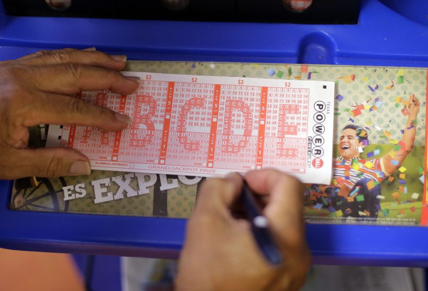 ** FILE ** A Powerball lottery form is filled out, Wednesday, Aug. 7, 2013, in San Antonio. (AP Photo/Eric Gay)
