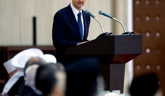 ** FILE ** In this Sunday, Aug. 4, 2013, photo released by the Syrian official news agency SANA, Syrian President Bashar Assad delivers a speech at an Iftar dinner with political and religious figures in Damascus, Syria. (AP Photo/SANA)