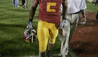 **FILE** Southern California running back Reggie Bush leaves the field after USC lost to Texas 41-38 in the Rose Bowl, the national championship college football game in Pasadena, Calif., Wednesday, Jan. 4, 2006. (AP Photo/Chris Carlson)