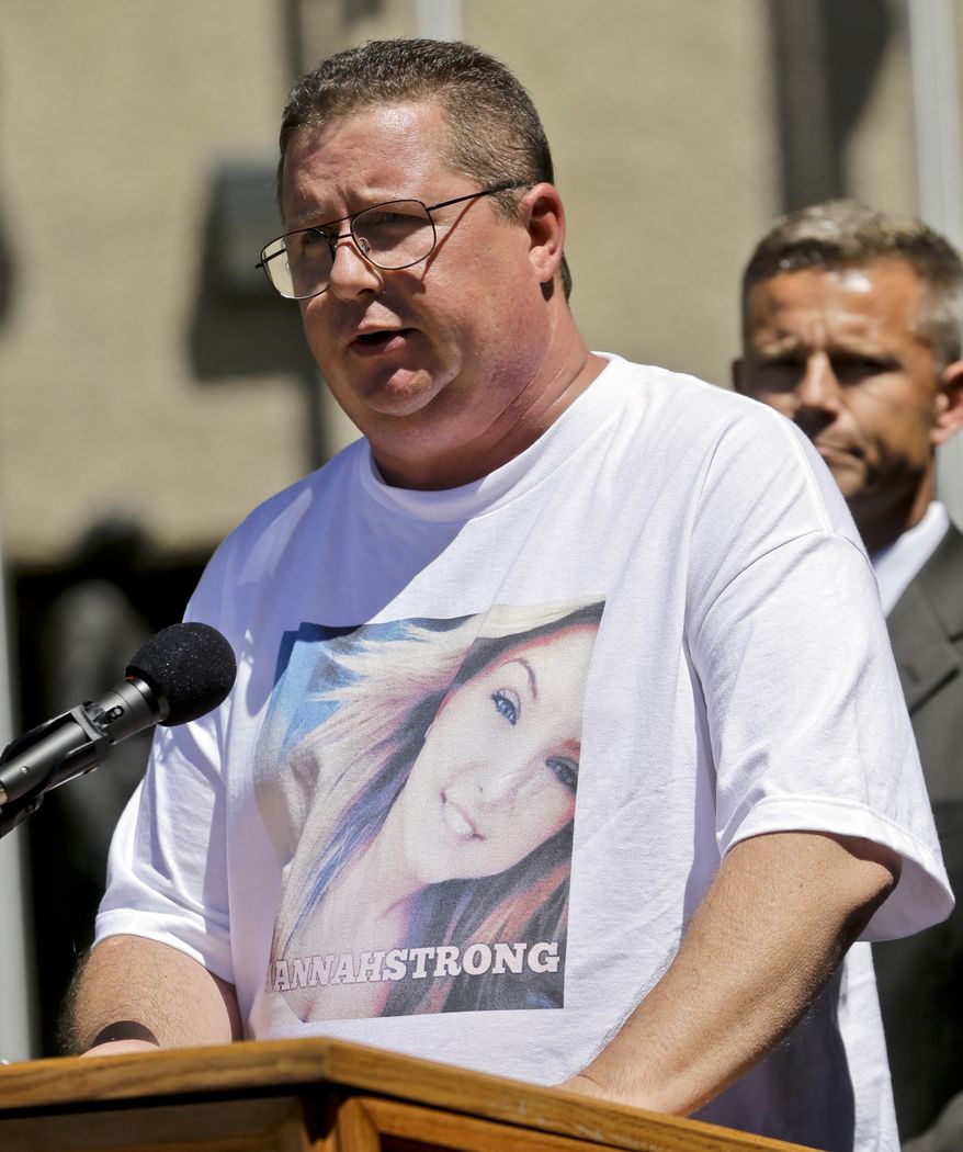 Brett Anderson, wearing a shirt featuring a photo of his daughter, Hannah, makes a statement regarding her kidnapping and rescue at a news conference Monday, Aug. 12, 2013, in San Diego. Anderson is flanked by FBI agent Rob Howe. James Lee DiMaggio, 40, suspected of killing Hannah's mother and brother before fleeing with her in the Idaho wilderness, was killed in a shootout with law enforcement on Saturday. (AP Photo/Lenny Ignelzi)