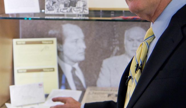 ** FILE ** In this Sept. 16, 2011, file photo, U.S. Sen. Lamar Alexander, R-Tenn., discusses papers and memorabilia on display in an exhibit about his political career at Vanderbilt University in Nashville, Tenn. (AP Photo/Erik Schelzig, file)