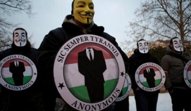 Members of the hacking group Anonymous. (Associated Press) 