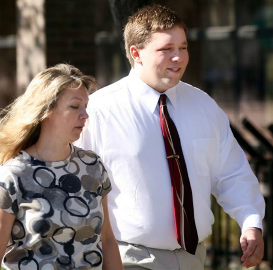 ** FILE ** Roy High School bomb plot suspect Joshua Kyler Hoggan, 16, right, walks out of the 2nd District Juvenile Court in Ogden with his mother, Janice Hoggan, April 4, 2011. (AP Photo/Standard-Examiner, Robert Johnson,File)