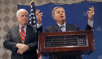 **FILE** U.S. Sens. John McCain (left) and Lindsey Graham talk during a press conference in Cairo on Aug. 6, 2013. (Associated Press)