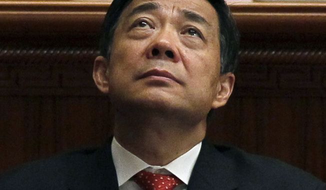 **FILE** Bo Xilai, then Chongqing party secretary, attends the closing session of the annual National People&#x27;s Congress in the Great Hall of the People, in Beijing on March 14, 2012. Xilai, a rising Communist Party star who fell from power last year, will go on trial Thursday on corruption charges, a court announced on Aug. 18, 2013, putting China&#x27;s new leaders on course to wrap up a festering scandal as they try to cement their authority. (Associated Press)