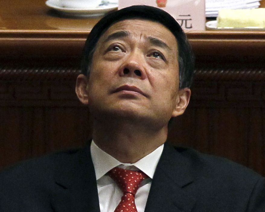 **FILE** Bo Xilai, then Chongqing party secretary, attends the closing session of the annual National People's Congress in the Great Hall of the People, in Beijing on March 14, 2012. Xilai, a rising Communist Party star who fell from power last year, will go on trial Thursday on corruption charges, a court announced on Aug. 18, 2013, putting China's new leaders on course to wrap up a festering scandal as they try to cement their authority. (Associated Press)