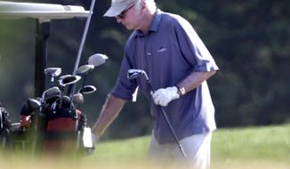 Actor Larry David returns a club to the cart while playing golf with President Obama at Farm Neck Golf Club in Oak Bluffs, Mass., on the island of Martha&#39;s Vineyard on Aug. 17, 2013. (Associated Press)