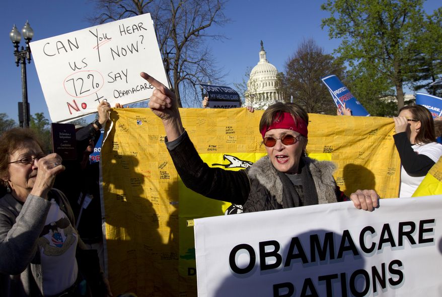 **FILE** Linda Door of Laguna Beach, Calif., protests outside the United States Supreme Court in Washington on March 26, 2012, as the court begins hearing arguments on the constitutionality of President Obama's health care overhaul, the Patient Protection and Affordable Care Act. (Associated Press)