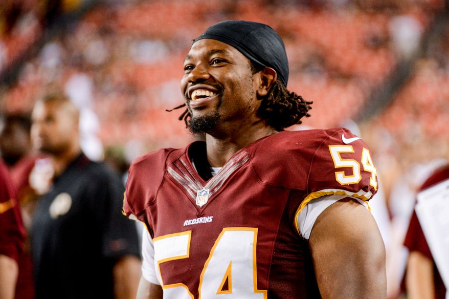 Washington Redskins linebacker Darryl Tapp (54) laughs on the sideline as the Washington Redskins play the Pittsburgh Steelers in NFL preseason football at FedEx Field, Landover, Md., Monday, August 19, 2013. (Andrew Harnik/The Washington Times)