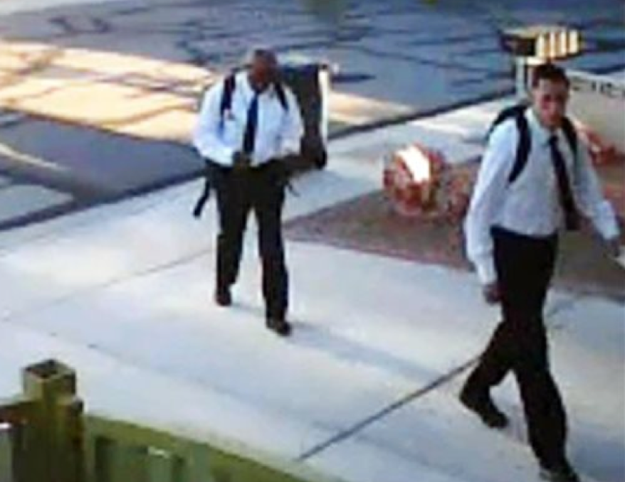 Home surveillance video shows two suspects who reportedly dressed as Mormon missionaries and asked a man to talk about religion before allegedly robbing him at gunpoint on Thursday, June 27, 2013, in Las Vegas. Police say the victim spoke with the men for about five minutes before they jumped him, punched him and stole property. (AP Photo/Las Vegas Metropolitan Police Department)