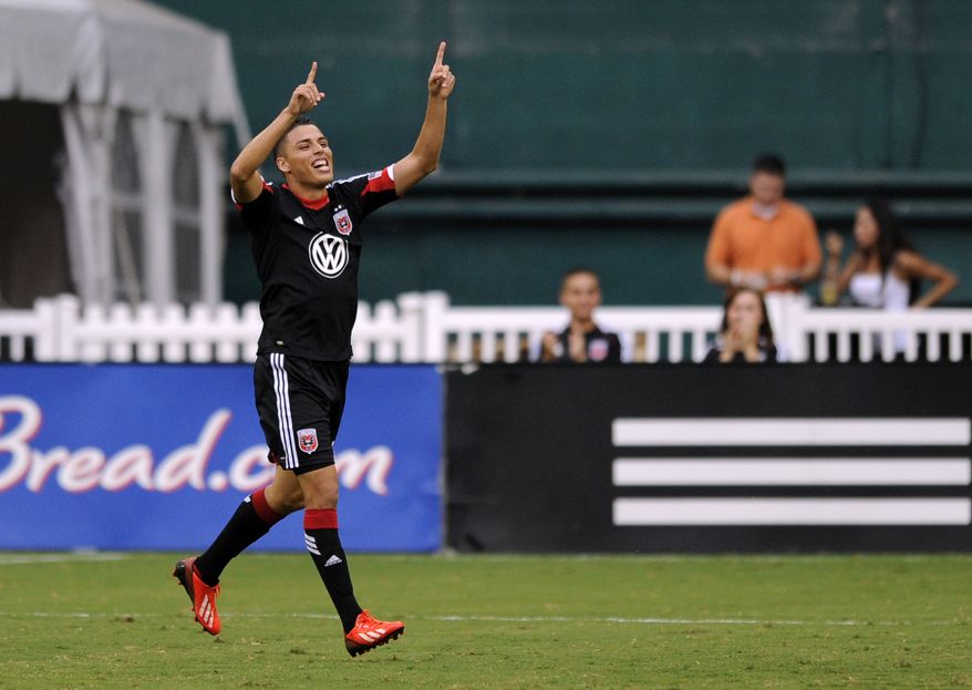 D.C. United midfielder Luis Silva celebrates his goal during the first half of an MLS soccer game against the New England Revolution, Saturday, July 27, 2013, in Washington. (AP Photo/Nick Wass)