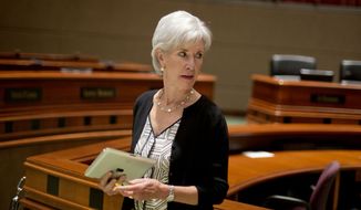 ** FILE ** Kathleen Sebelius, secretary of health and human services, leaves the podium after discussing the Affordable Care Act at a news conference in Atlanta on Tuesday, Aug. 13, 2013. (AP Photo/David Goldman)