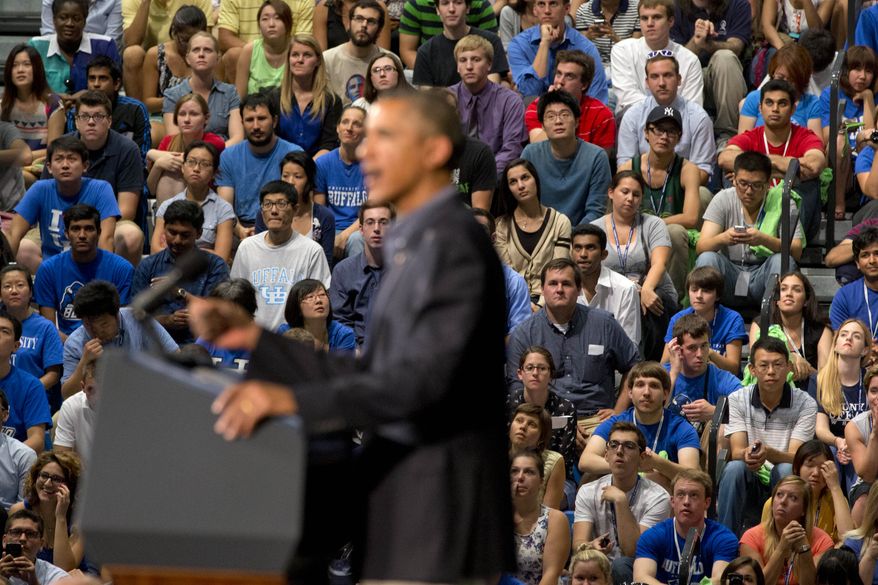 Students listen as President Obama speaks at the University at Buffalo in Buffalo, N.Y., on Thursday, Aug. 22, 2013, at the beginning of a two-day bus tour. (AP Photo/Jacquelyn Martin)
