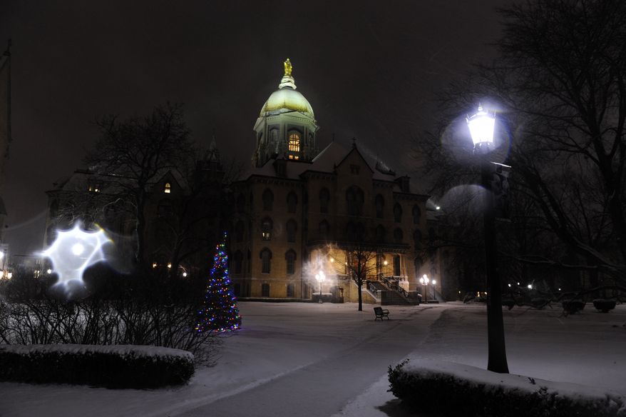 ** FILE ** The Golden Dome on the campus of the University of Notre Dame outside South Bend, Ind., is pictured on Dec. 26, 2012. (Associated Press)