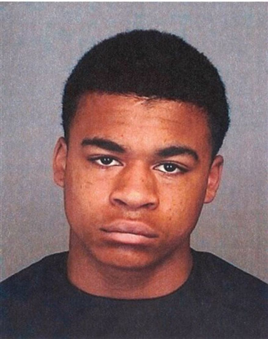 ** FILE ** Kenan Adams-Kinard, 16, was arrested by police in connection with the beating death of an 88-year-old World War II veteran outside an Eagles lodge in Spokane on Wednesday, Aug. 21, 2013. (AP Photo/Spokane Police)
