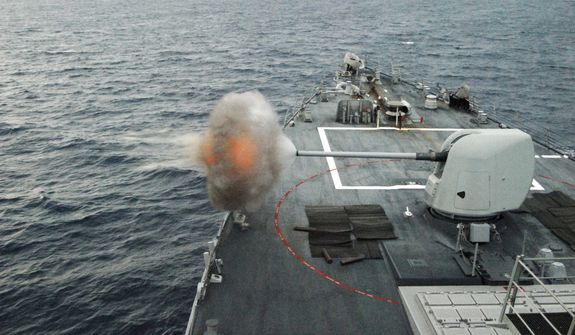 ** FILE ** In this June 6, 2010, file photo, the guided-missile destroyer USS Mahan (DDG 72) fires its MK-45 5-inch/54-caliber lightweight gun during a live-fire weapons exercise in the Atlantic Ocean. Mahan is at sea participating in the Southeast Anti-Submarine Warfare Integration Training Initiative (SEASWITI) exercise 10-3. The multinational exercise is designed to improve their anti-submarine warfare readiness and proficiency. (U.S. Navy photo by Mass Communication Specialist 1st Class Daniel Gay/Released)