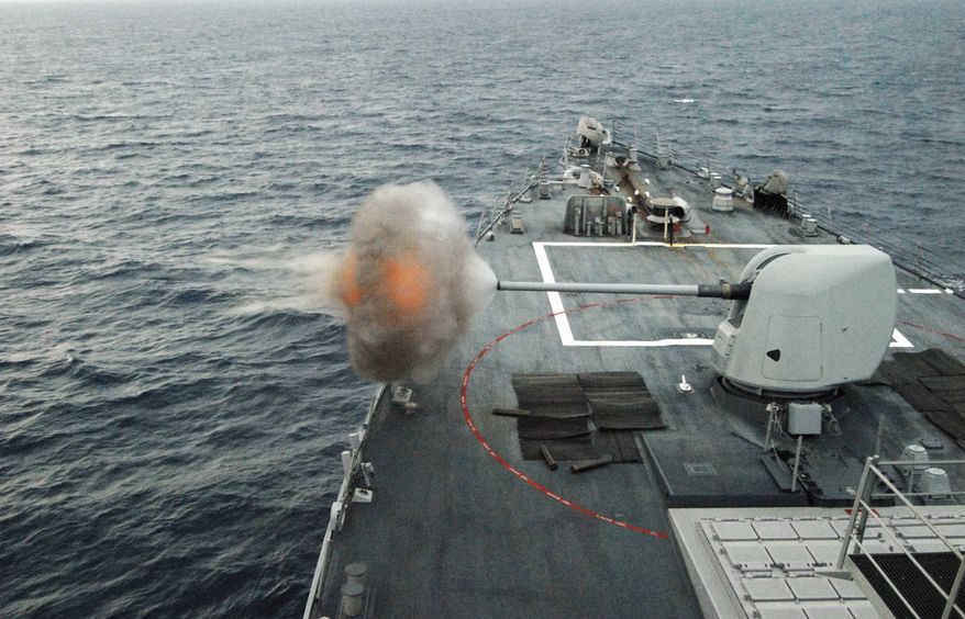 ** FILE ** In this June 6, 2010, file photo, the guided-missile destroyer USS Mahan (DDG 72) fires its MK-45 5-inch/54-caliber lightweight gun during a live-fire weapons exercise in the Atlantic Ocean. Mahan is at sea participating in the Southeast Anti-Submarine Warfare Integration Training Initiative (SEASWITI) exercise 10-3. The multinational exercise is designed to improve their anti-submarine warfare readiness and proficiency. (U.S. Navy photo by Mass Communication Specialist 1st Class Daniel Gay/Released)
