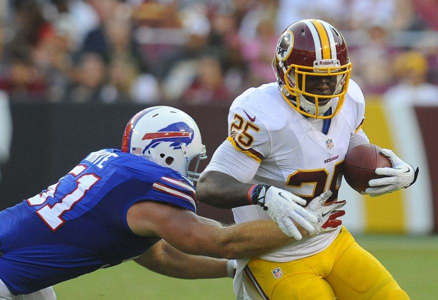 Washington Redskins running back Keiland Williams, right, rushes past Buffalo Bills linebacker Chris White in the second half of an NFL preseason football game Saturday, Aug. 24, 2013, in Landover, Md. (AP Photo/Richard Lipski)