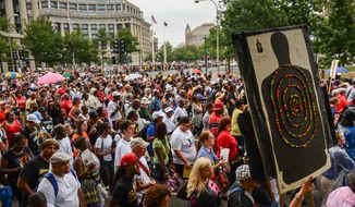 People participate in a march down Pennsylvania Avenue to commemorate the 50th anniversary of the March on Washington and Martin Luther King Jr.&#39;s famous &quot;I Have a Dream&quot; speech in D.C. on Aug. 28, 2013. (Andrew Harnik/The Washington Times)