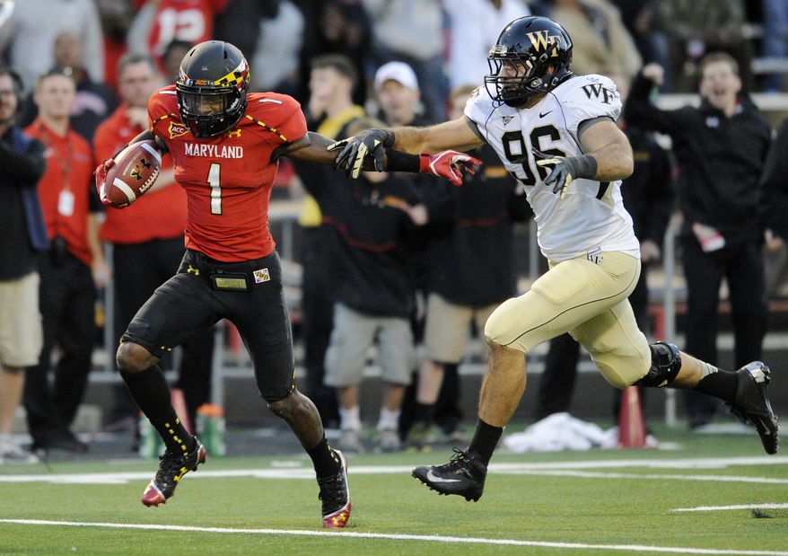 **FILE** Maryland wide receiver Stefon Diggs (1) runs with the ball after a catch for a 63 yard gain against Wake Forest defensive end Hasan Hazime (96) during the second half of an NCAA football game, Saturday, Oct. 6, 2012, in College Park, Md. Maryland won 19-14. (AP Photo/Nick Wass)