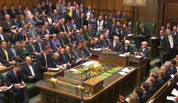 In this image taken from video, Britain&#39;s Prime Minister David Cameron, front left, stands to speak to the assembled parliament during a debate on Syria, in Britain&#39;s parliament, London, Thursday Aug. 29, 2013. Britain&#39;s leaders said Thursday it would be legal under humanitarian doctrine to launch a military strike against Syria even without authorization from the United Nations Security Council, but it is not certain how much support there is for the government&#39;s resolution on Syria. (AP Photo / PA) UNITED KINGDOM OUT - NO SALES - NO ARCHIVES