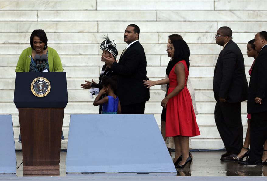 Rev. Dr. Bernice King, CEO of The King Center for Non-Violent Social Change, and daughter of Martin Luther King Jr., speaks as members of the King family walk behind at the Let Freedom Ring ceremony at the Lincoln Memorial Wednesday, Aug. 28, 2013, in Washington, to commemorate the 50th anniversary of the 1963 March on Washington for Jobs and Freedom. (AP Photo/Carolyn Kaster)
